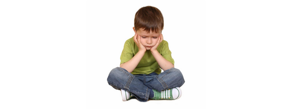 Little boy sitting down and reframing negative thoughts